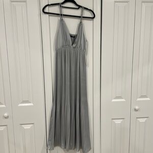 Sara pleated silky “grey/silver” colored dress. Never worn with tags. Size Xs